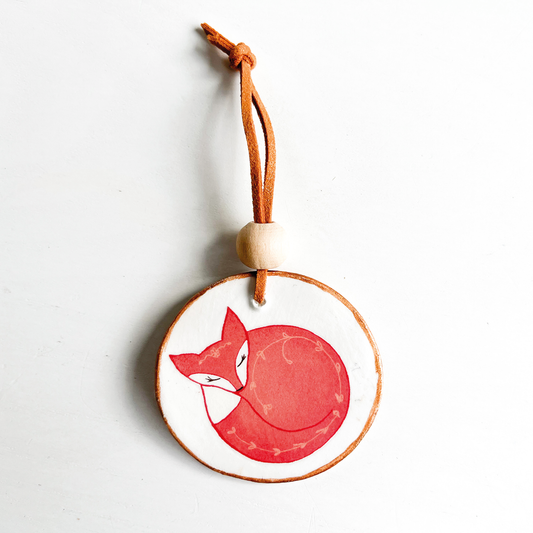 Hanger slapend vosje