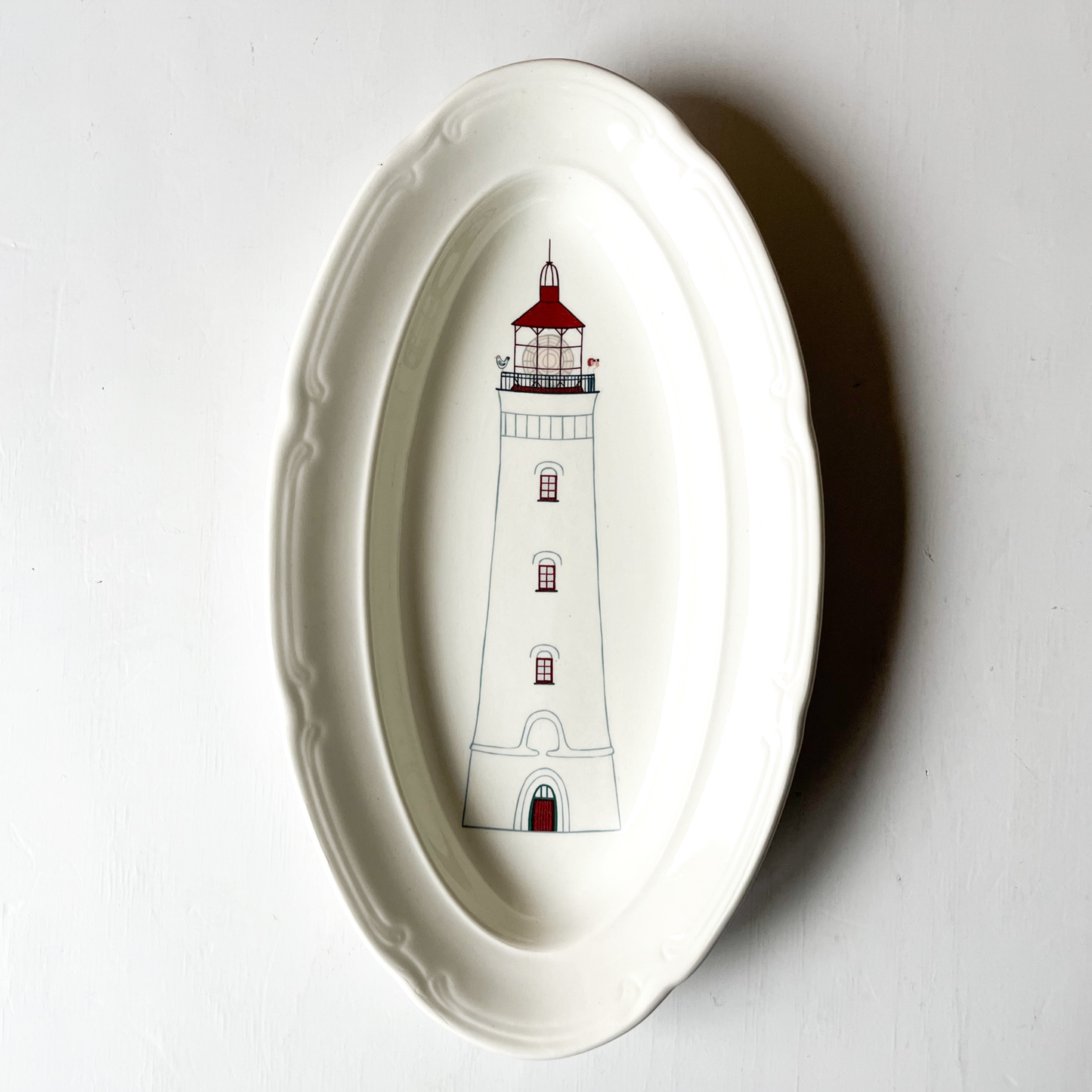 Wandbordje met witte vuurtoren